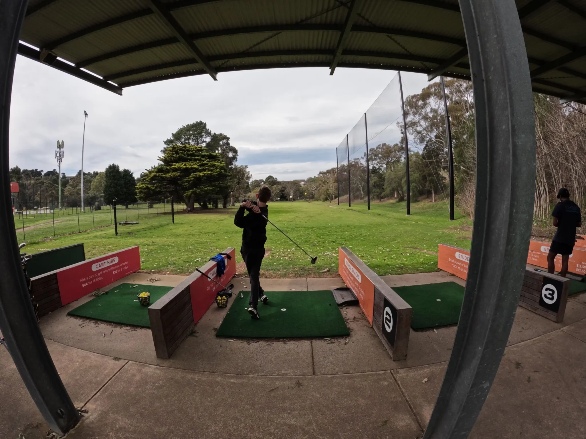 Client participating in an outdoor golf therapy session in Geelong